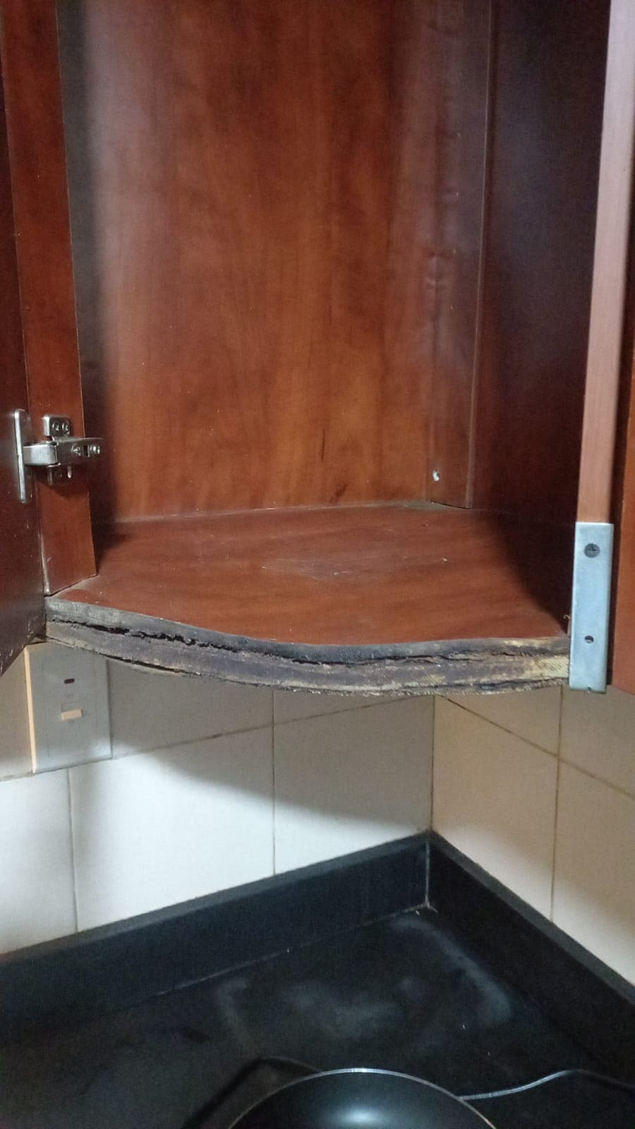 Damaged, unmaintained cabinetry in a Dubai Marina apartment left in poor condition