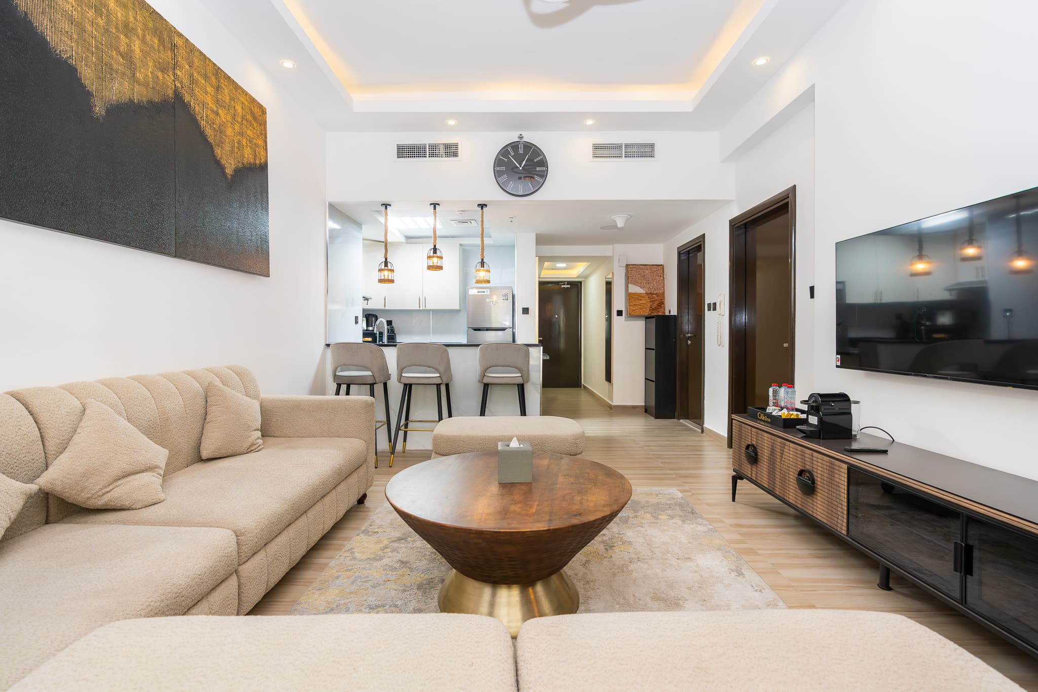 Living room with skyline view in a Dubai Marina apartment managed by StayliaDXB