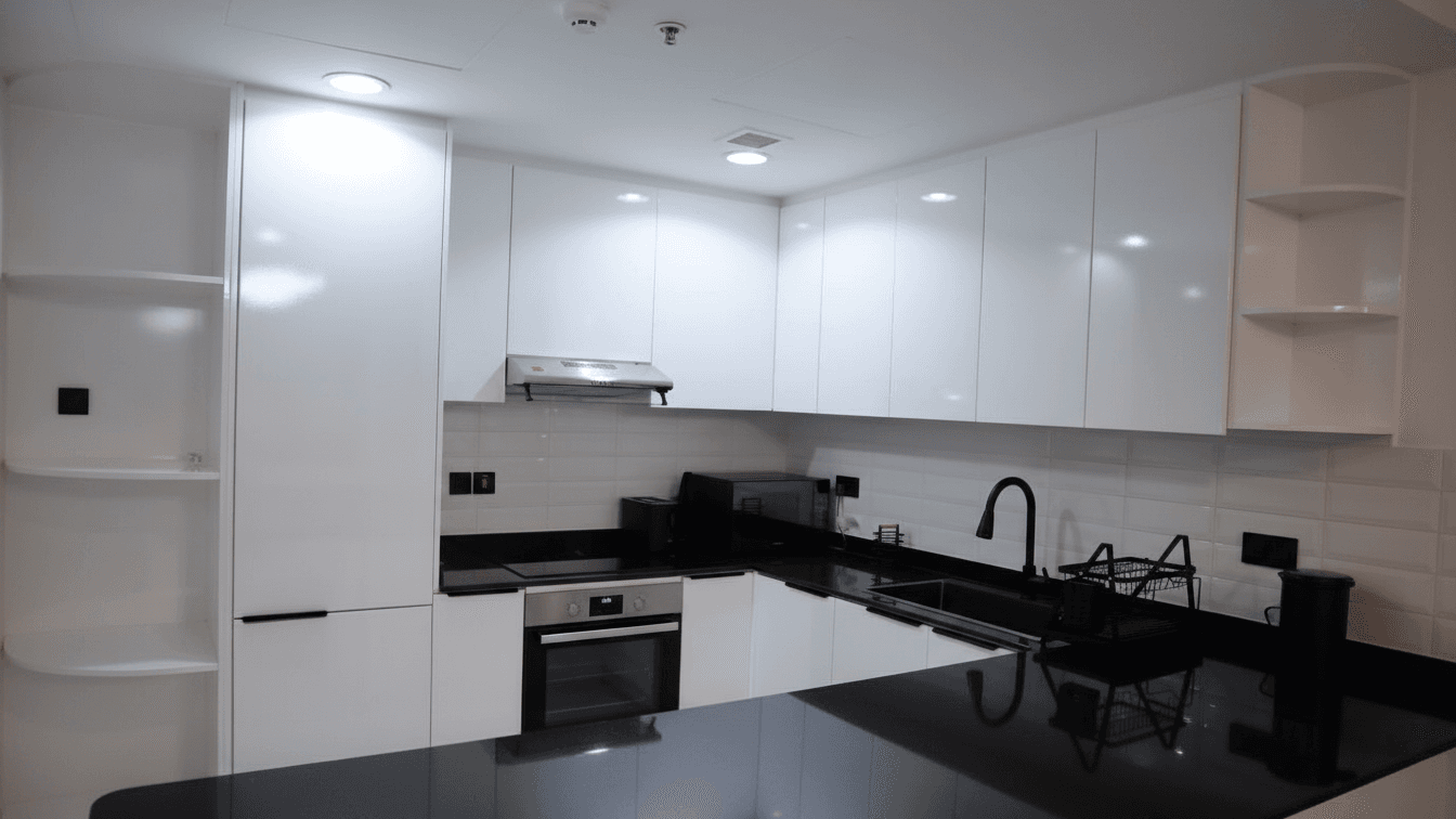 Business Bay apartment kitchen renovated and managed as a holiday home by StayliaDXB